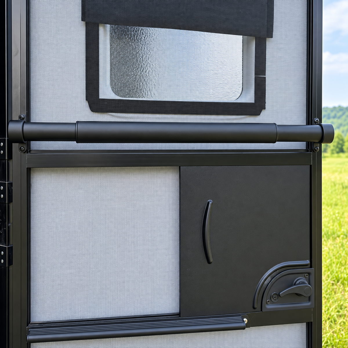 Black RV screen door crossbar installed across a camper screen door