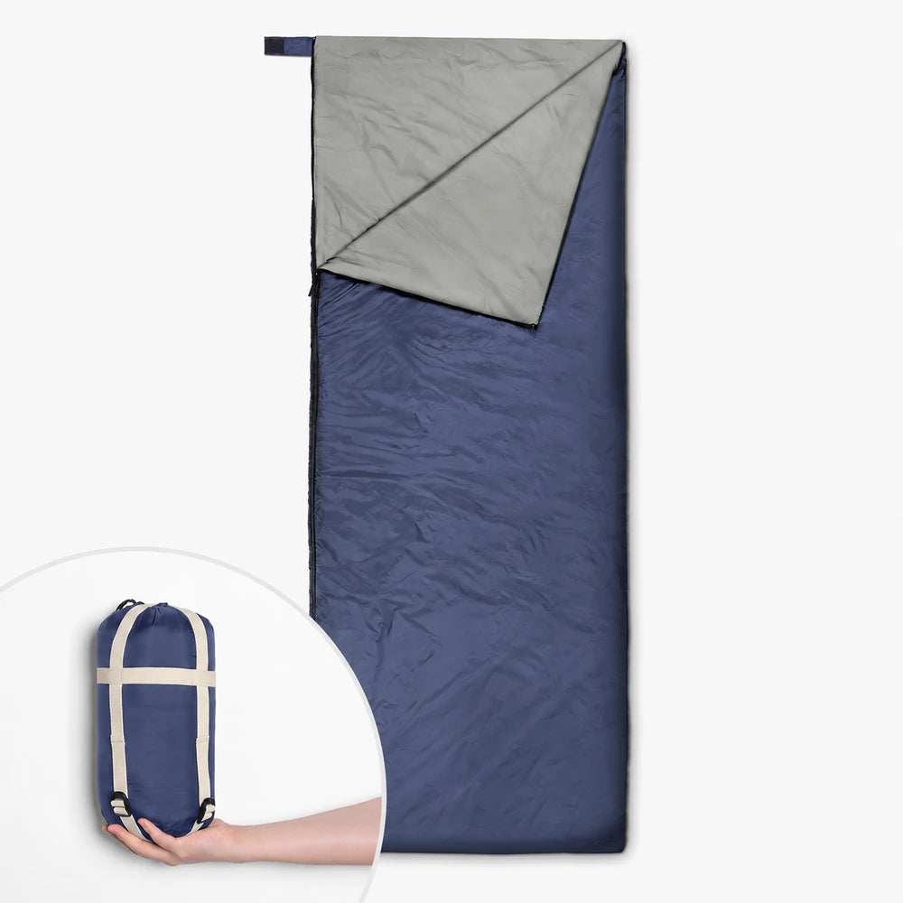 Unbranded blue rectangular ultralight 3-season sleeping bag with grey lining and compact storage sack