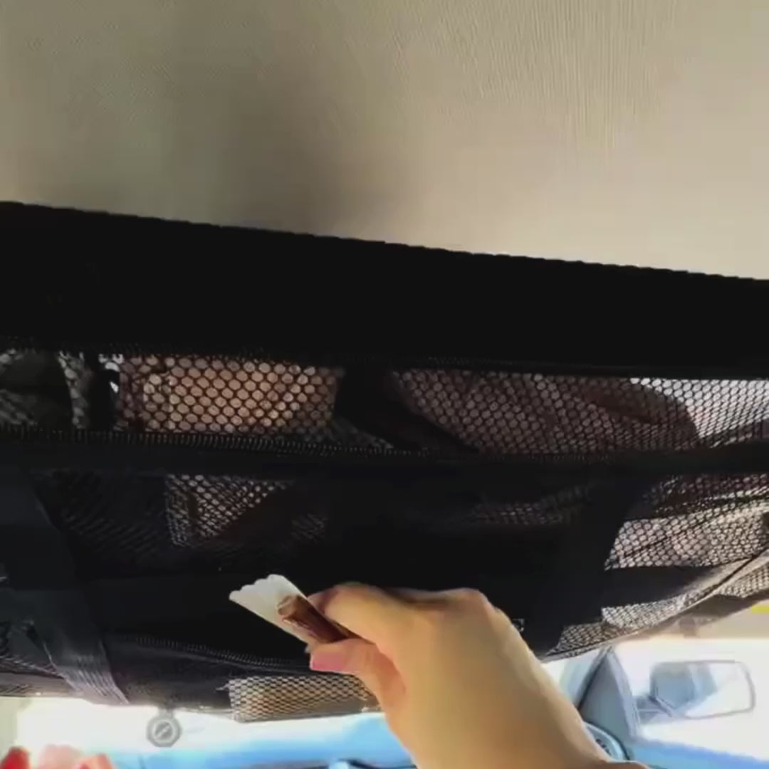 Load video: Overhead car ceiling storage net frees passenger and boot space