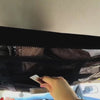 Overhead car ceiling storage net frees passenger and boot space